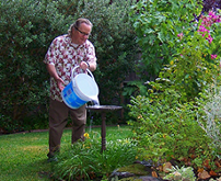 Don refills the bird bath